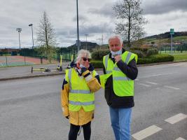 Rotarians Mollie & Geoff on car parking duties